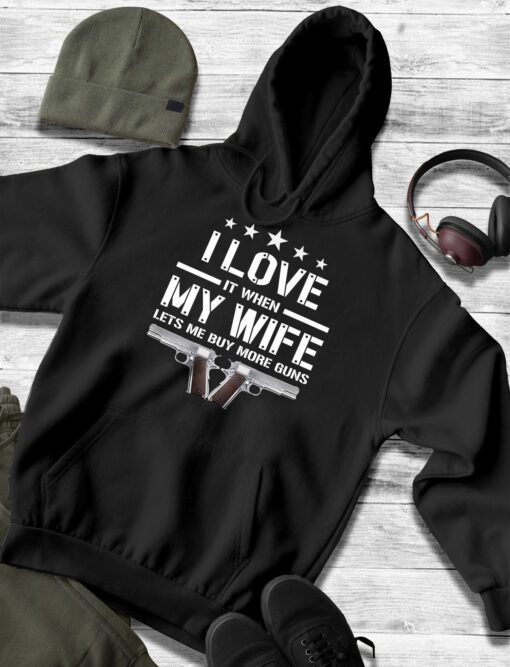 2020-11-Men-Hoodie-Mens-Funny-I-Love-It-When-My-Wife-Lets-Me-Buy-More-Guns-Husband-mockup3-black.jpg